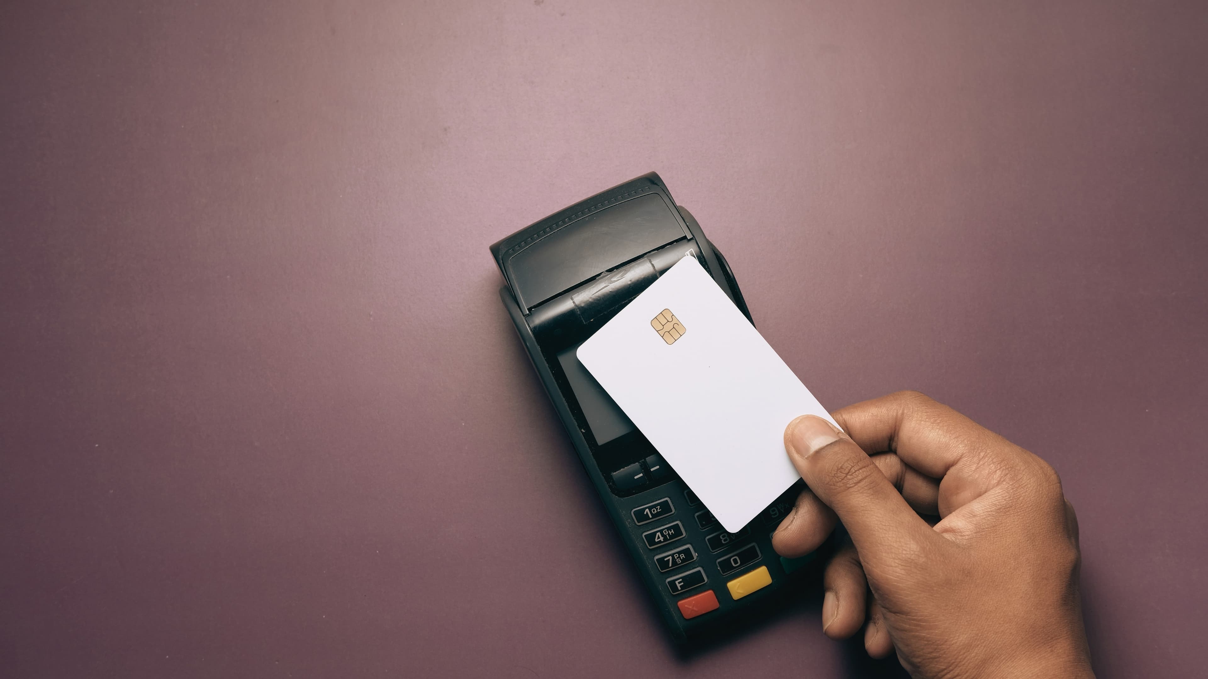 Customer presenting a card to a payment terminal